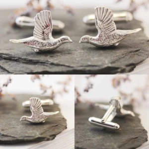 A collection of images of silver pheasant cufflinks.