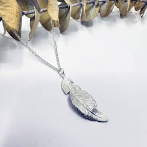 Sterling silver feather necklace handmade by Heather Scott Jewellery.