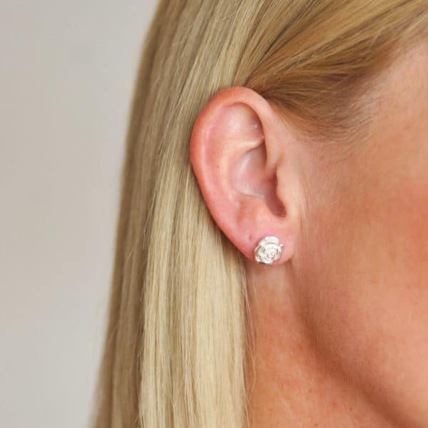 Rose earrings worn