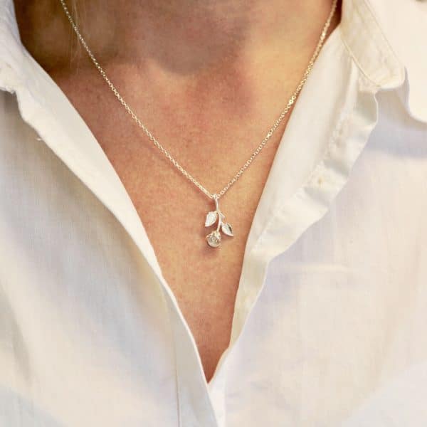 Silver rose necklace worn
