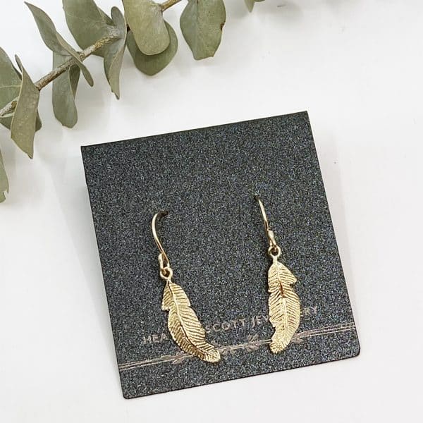 Gold feather earrings