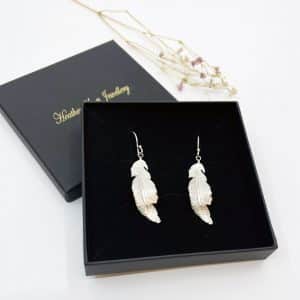 Large feather earrings boxed