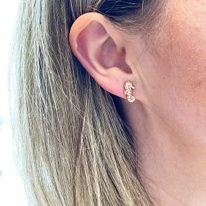 Gold seahorse earrings worn