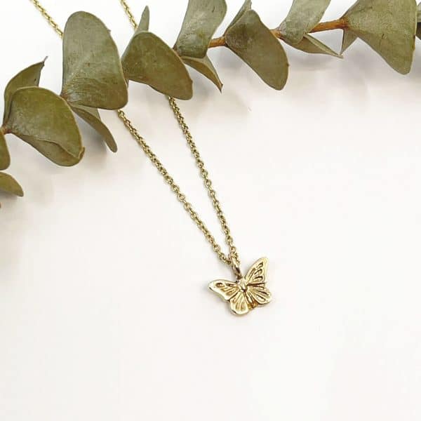 Tiny gold butterfly necklace
