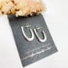 Fluid silver hoop studs